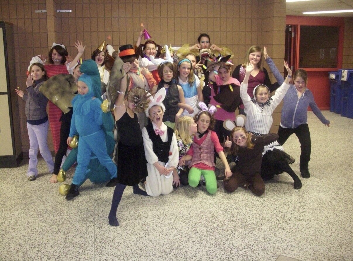Charles as the Mad Hatter with the cast of Evergreen Heights' Alice in Wonderland